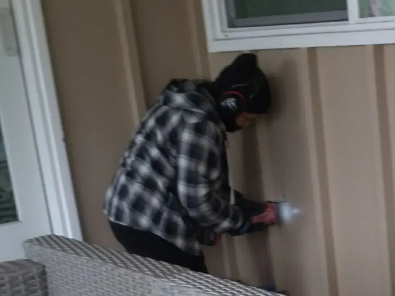 Professional electrician installing an exterior outlet in Denver